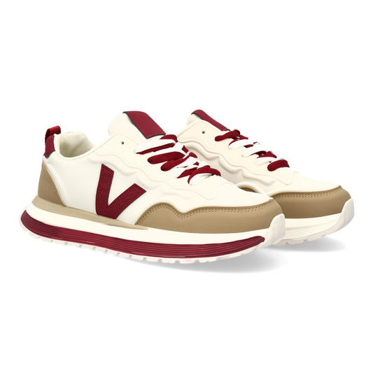 Zapatilla deportiva con Diseño moderno y suela dentada. Detalles de contraste  c