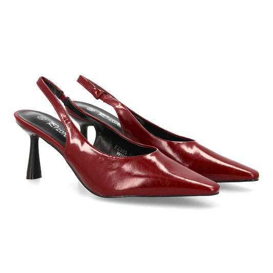 Zapato de salón destalonado con punta y tacon fino. Estampado liso  cierre elást